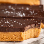 close up image of a bite taken out of a healthy peanut butter cup bars.