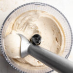 1 ingredient nice cream recipe in a food processor with an ice cream scoop.