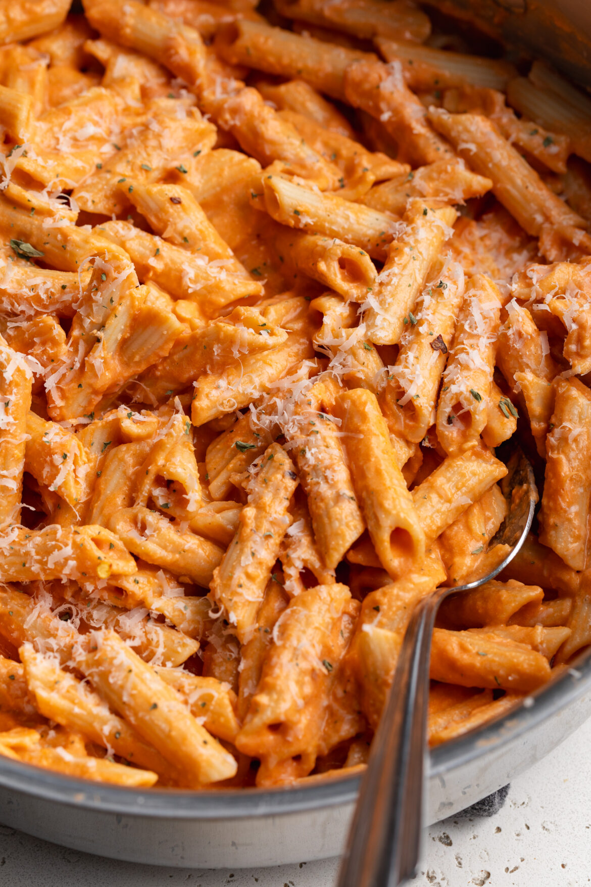 Cottage Cheese Vodka Pasta cottage cheese vodka pasta in a skillet with a spoon.