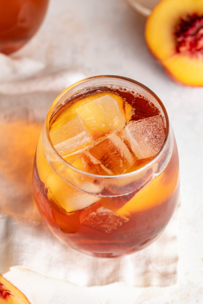 overhead image of summer rose sangria with peaches on the side.