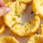 Pulling apart a cheesy cottage cheese egg bite.