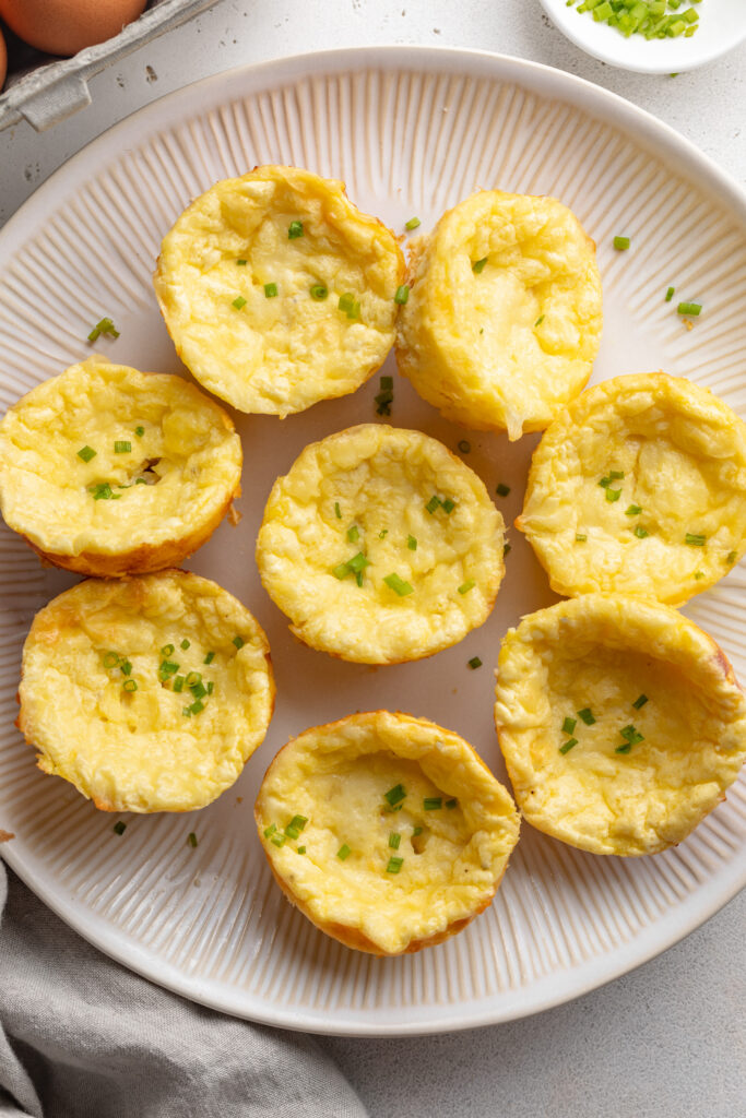 overhead image of cottage cheese egg bites on a plate.