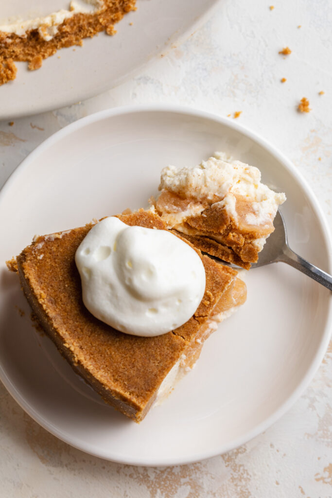 overhead image of a slice of apple pie upside down cheesecake.