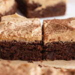 espresso martini brownies lined up on a table.