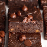 close up image of sweet potato brownies stacked on top of each other.