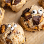a row of cottage cheese monster cookie dough bite on a baking sheet.