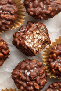 close up image of mini crunchy peanut butter cup with a bite taken out.