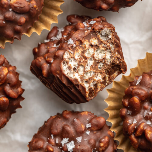 close up image of mini crunchy peanut butter cup with a bite taken out.