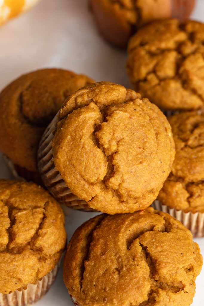 overhead image of a pile of pumpkin protein muffins.